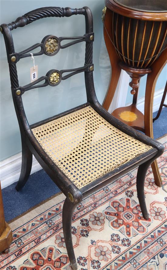 Two similar Regency ebonised canework chairs